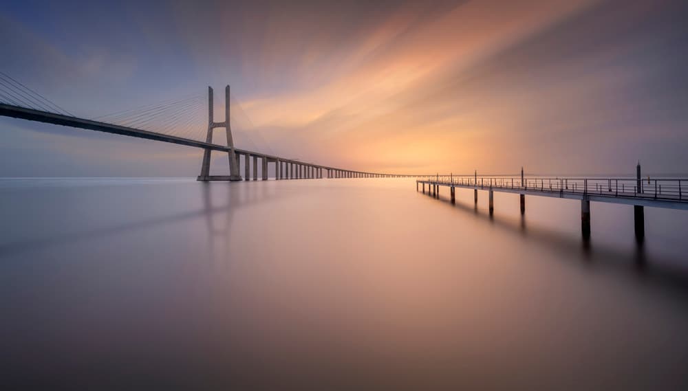 Long Bridge Sunset Reflection by Jorge Ruiz Dueso — canvas wall art