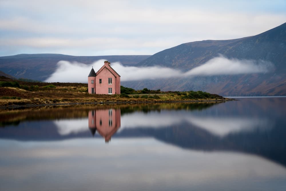 Serene Pink House Reflection by John Deakin — canvas wall art