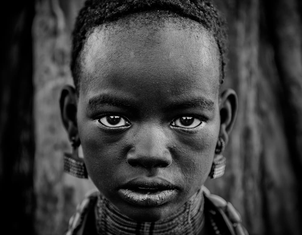 African Child's Gaze by Mohammed Al Sulaili — canvas wall art