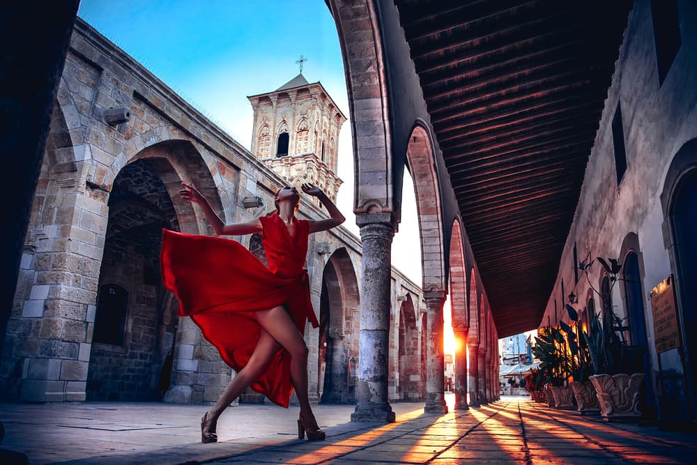 Golden Hour Red Dress by Ruslan Bolgov — canvas wall art