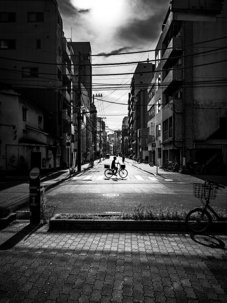 Solitary City Cyclist by Kenichiro Tsukada — canvas wall art