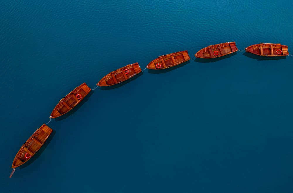 Row Boats on Blue Water by erwin hodister — canvas wall art