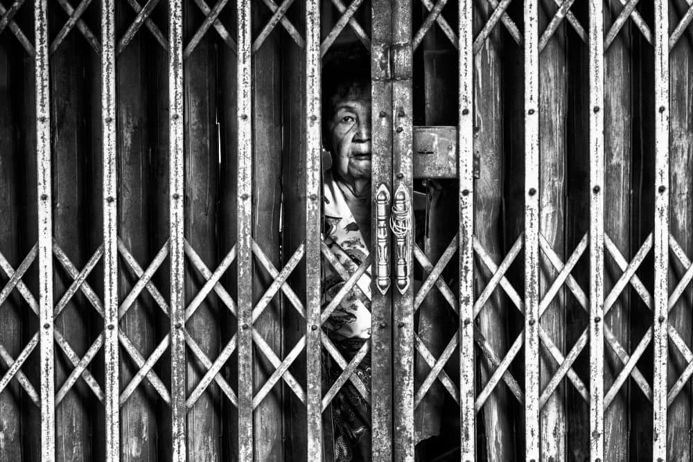 Elderly Woman Peeking by Milton Louiz — canvas wall art