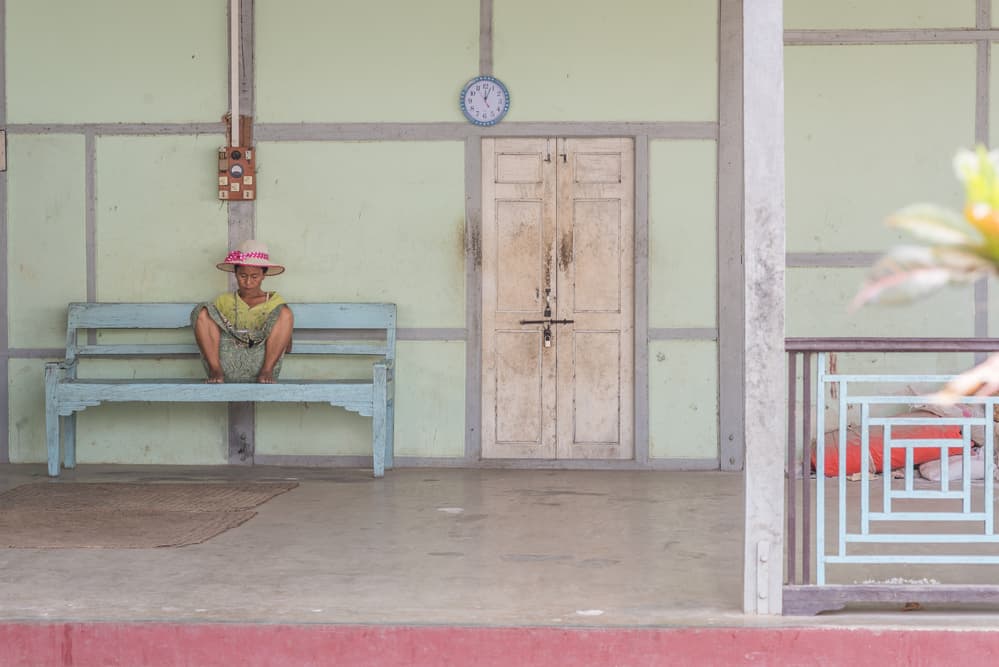 Patient Woman on Bench by Patrick Dessureault — canvas wall art
