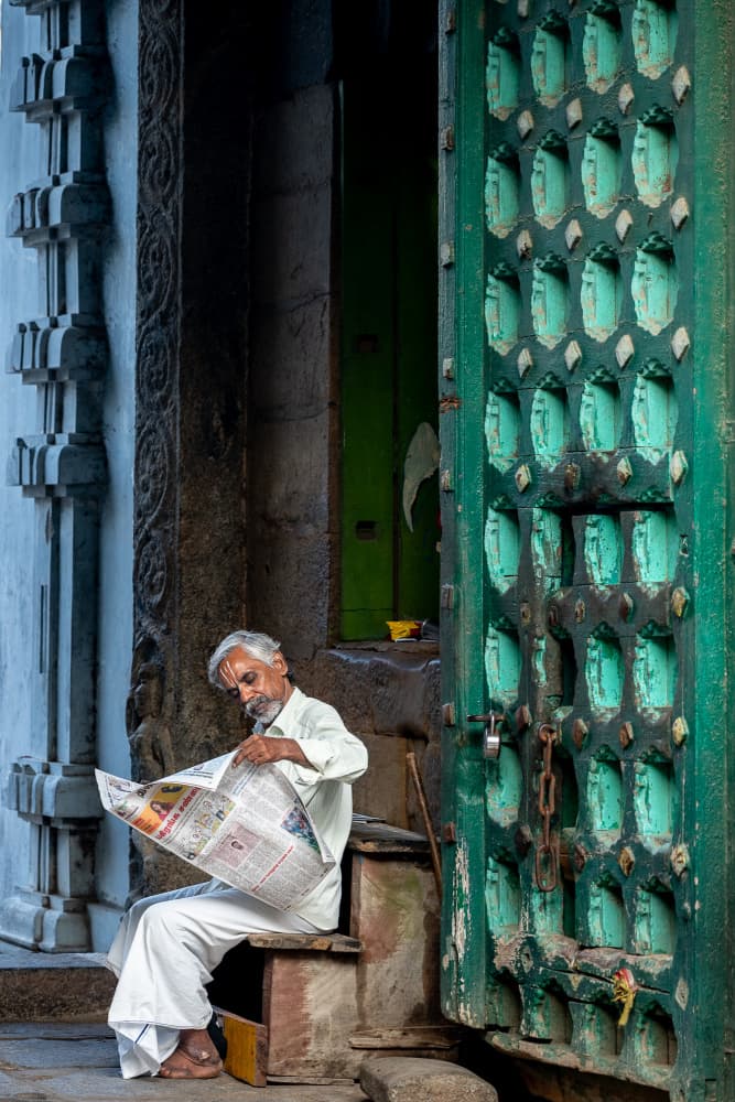 Indian Man Reading Newspaper by BALASUBRAMANIAN GV — canvas wall art