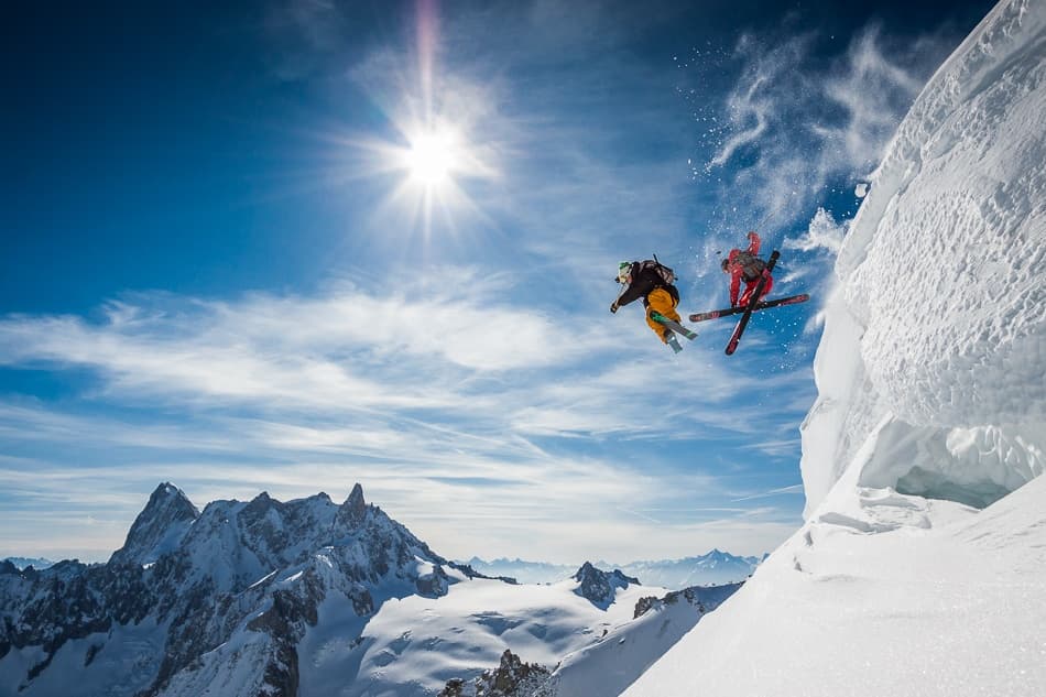 Skiers Jumping Mountains by Tristan Shu — canvas wall art