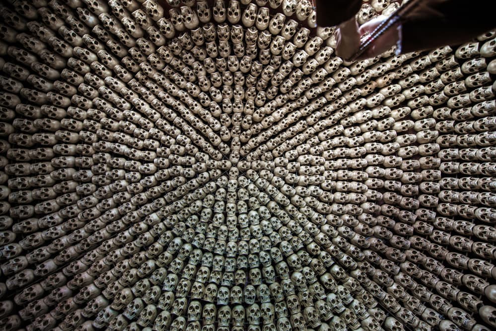 Spiral of Skulls by Sarawut Intarob — canvas wall art