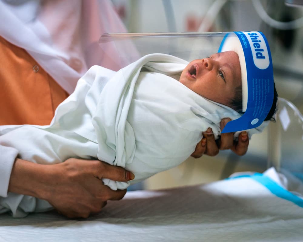 Newborn Baby Face Shield by Haitham AL Farsi — canvas wall art