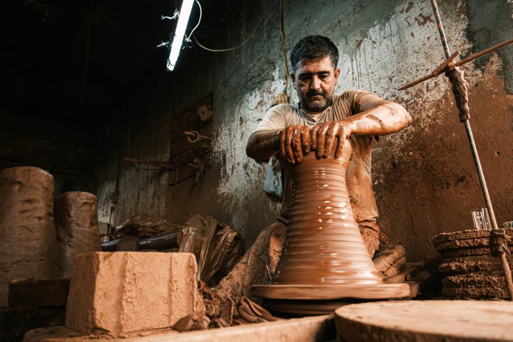 Potter at the Wheel by Ali Ayer — canvas wall art