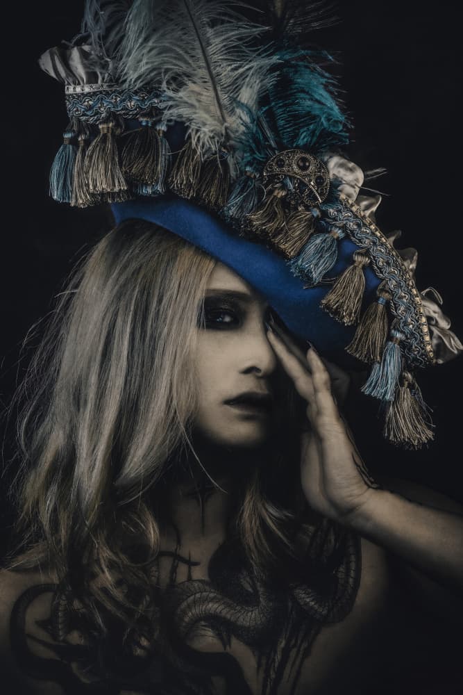 Mysterious Blue Hat Gaze by KOIKI — canvas wall art