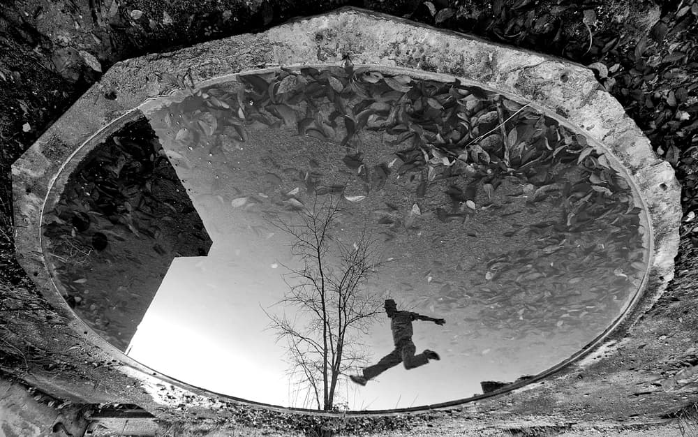 Jumping Man Reflection by Carlo Ferrara — canvas wall art