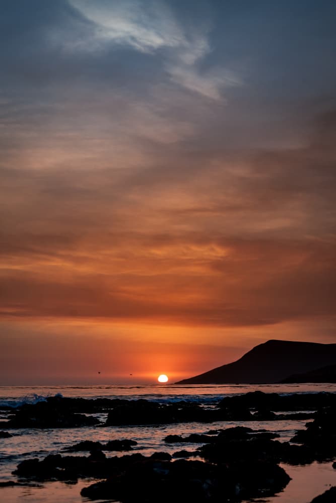Fiery Ocean Sunset by Tim Mossholder — canvas wall art