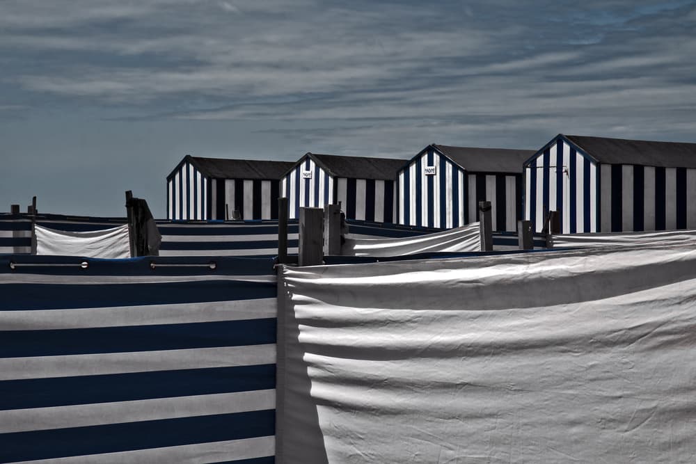 Blue Striped Beach Huts by Gilbert Claes — canvas wall art