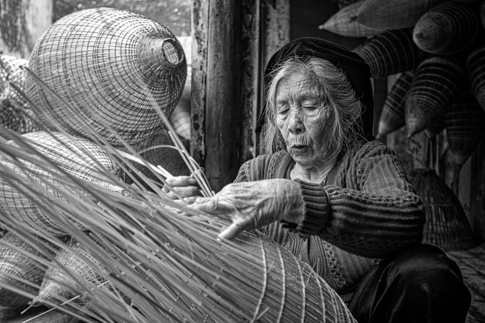 Elderly Craftswoman Weaving Tradition by Azim Khan Ronnie — canvas wall art