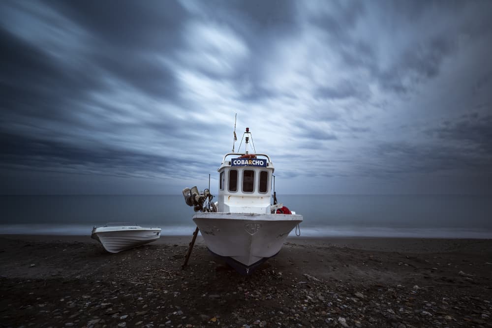 Dark Beach Fishing Boat by Manuel Jose Guillen Abad — canvas wall art
