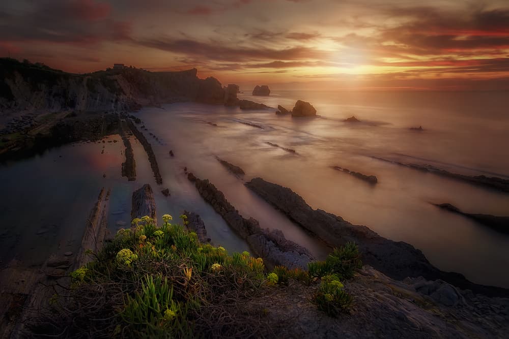 Dramatic Coastal Sunset by Iván Ferrero — canvas wall art