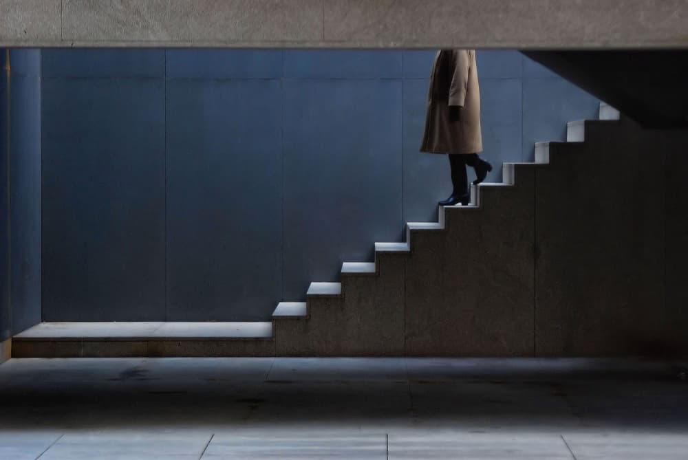 Person Ascending Modern Stairs by Luis Câmara — canvas wall art