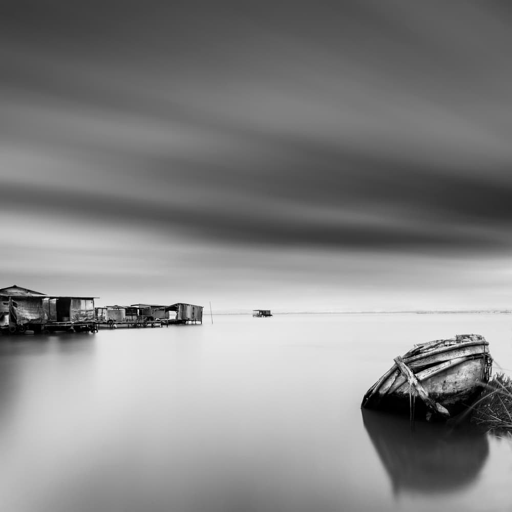 Serene Waters Abandoned Boat by George Digalakis — canvas wall art