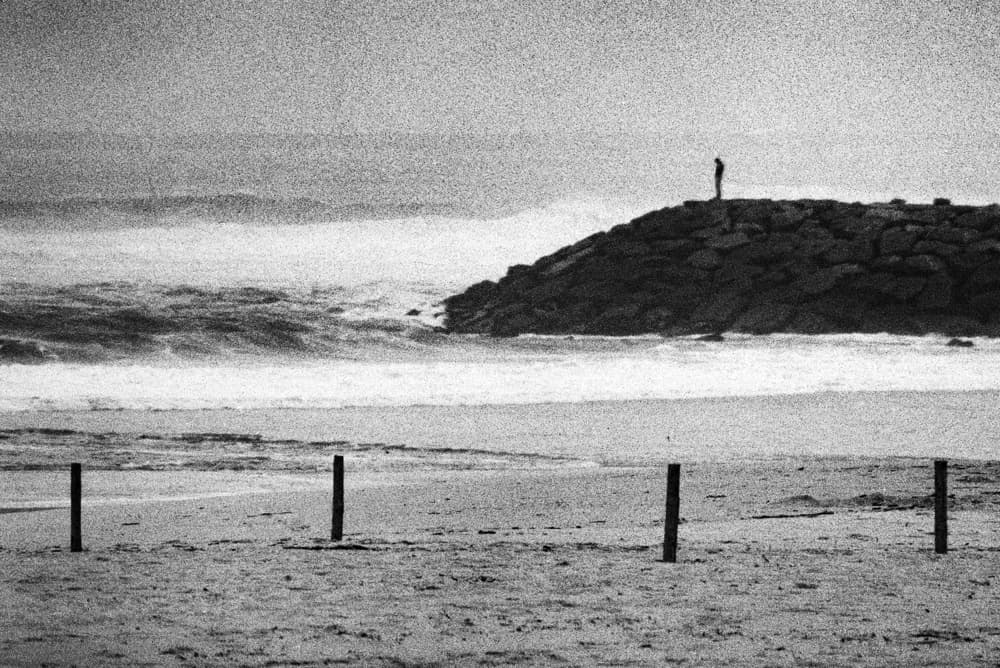 Lone Figure Ocean View by Paulo Abrantes — canvas wall art
