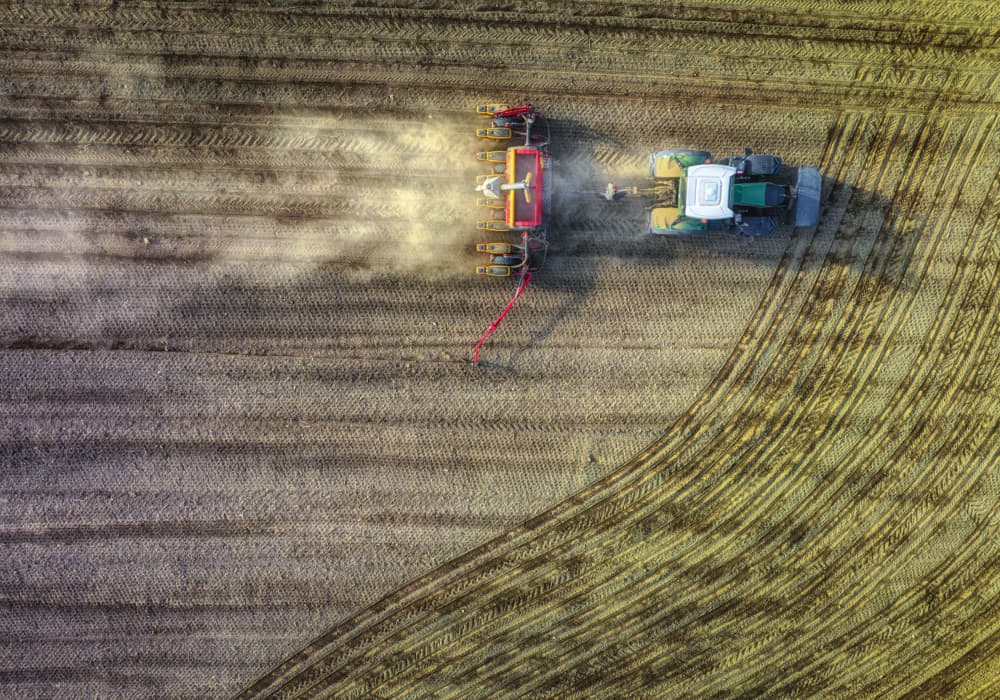 Tractor Working Field by Guy Krier — canvas wall art