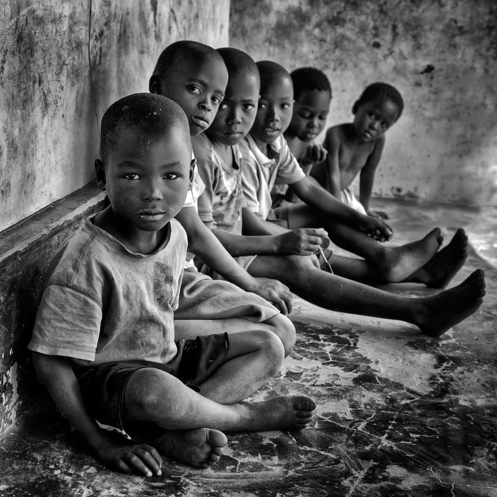 African Boys Sitting by Foad Mirzaie — canvas wall art