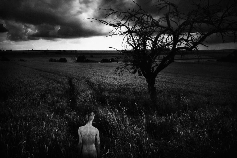 Lone Figure Dark Landscape by Holger Droste — canvas wall art