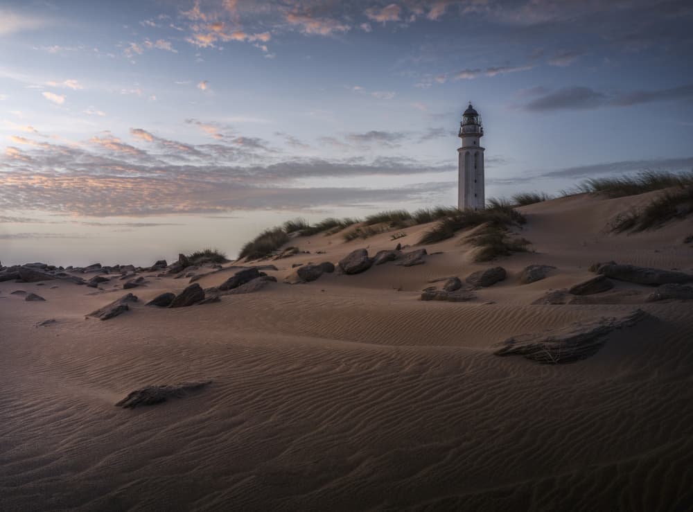Twilight Lighthouse Beach by Josema Martin Espinar — canvas wall art