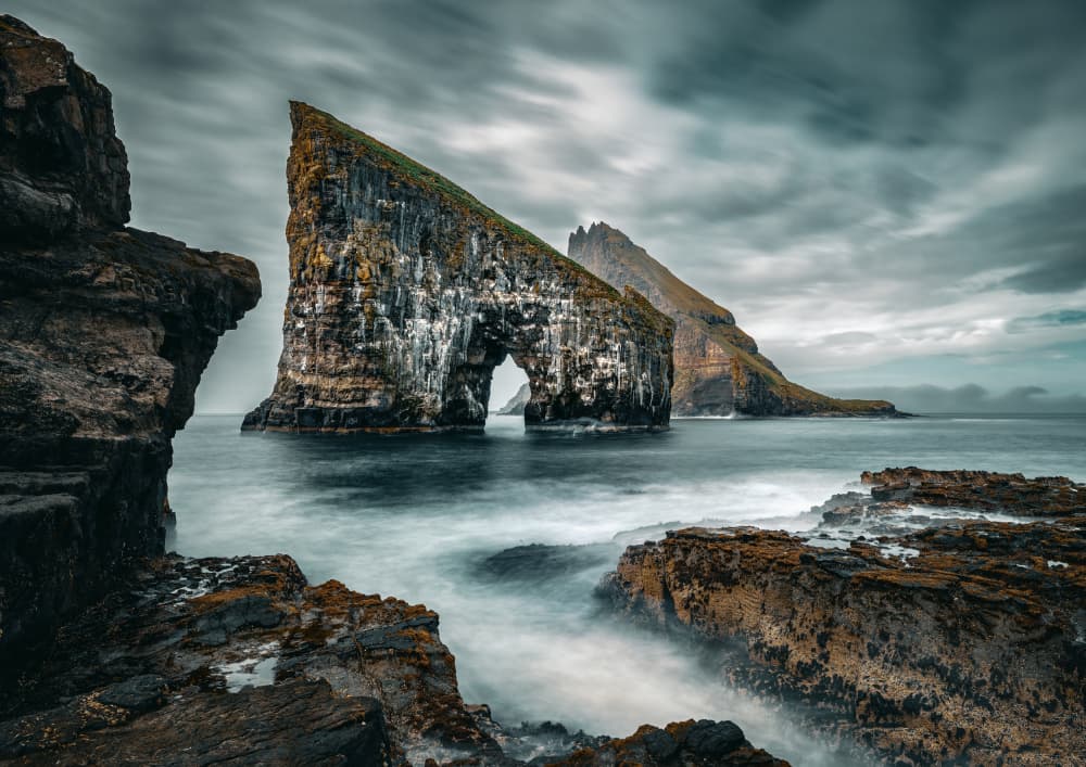 Misty Sea Stack Arch by Ariel Ling — canvas wall art