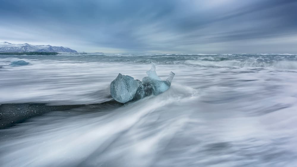 Flowing Waves Embrace Ice by James Zhen Yu — canvas wall art