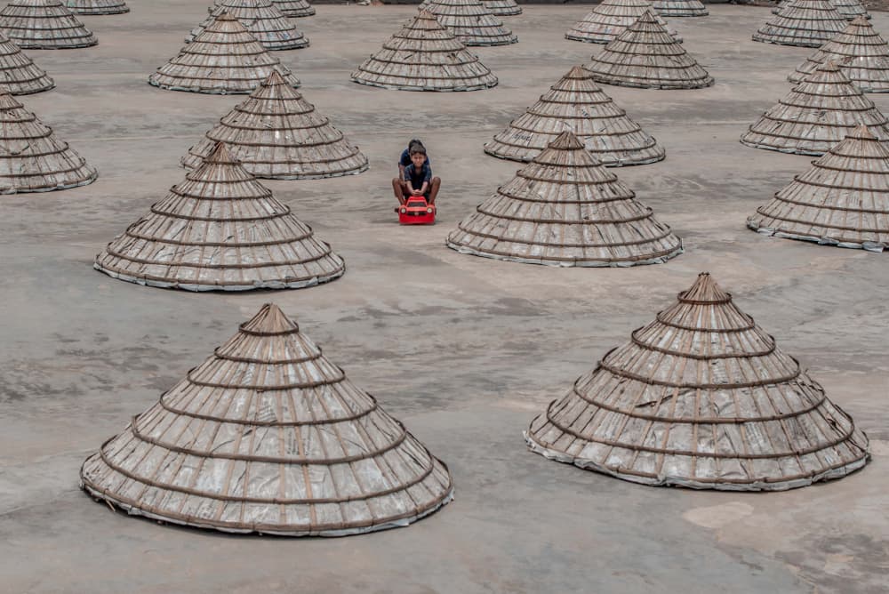 Child Among Salt Cones by Rakibul Alam Khan — canvas wall art