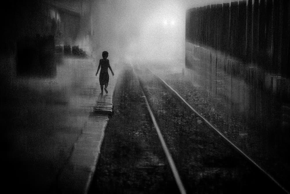 Child on Misty Tracks by António Carreira — canvas wall art