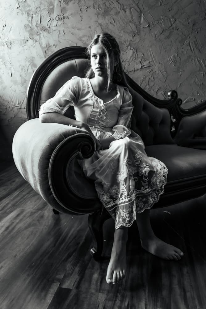 Pensive Woman Vintage Sofa by Gila Koller — canvas wall art