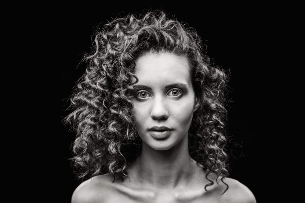 Intense Curly Haired Woman by Photographer — canvas wall art