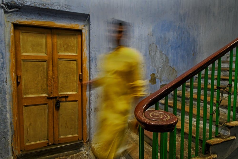 Yellow Figure Old Door by Shaibal Nandi — canvas wall art