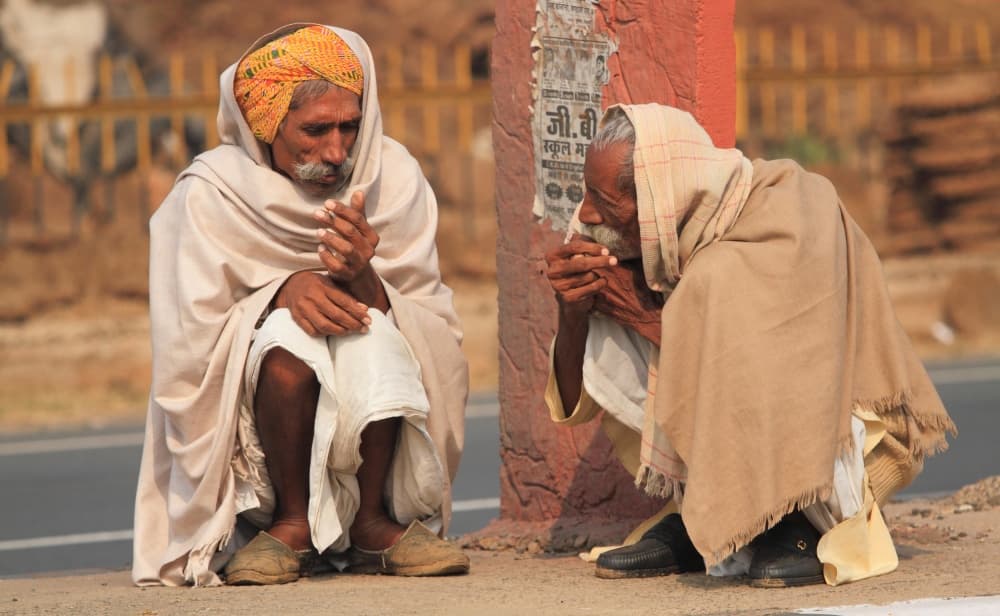 Elderly Men Seeking Warmth by Ugur Erkmen — canvas wall art