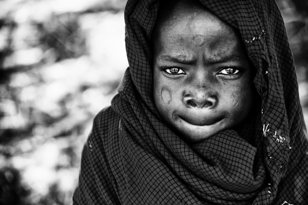 Pensive African Child by Goran Jovic — canvas wall art