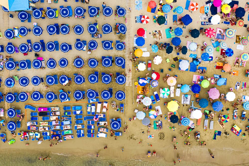 Vibrant Beach Umbrellas Aerial by Davide Lopresti — canvas wall art