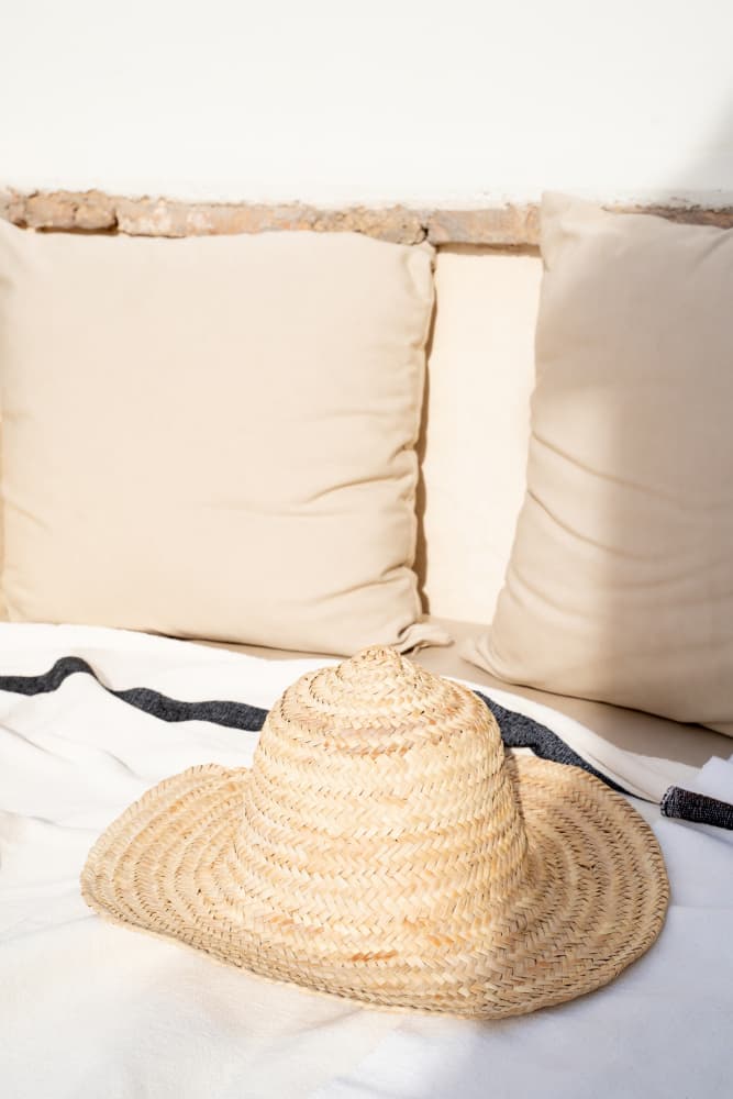 Sunny Straw Hat Scene by Henrike Schenk — canvas wall art