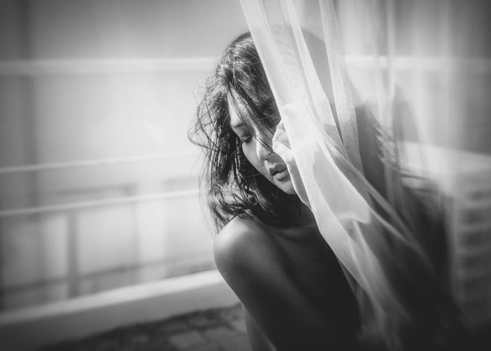 Pensive Woman In Light by ADIREK M — canvas wall art