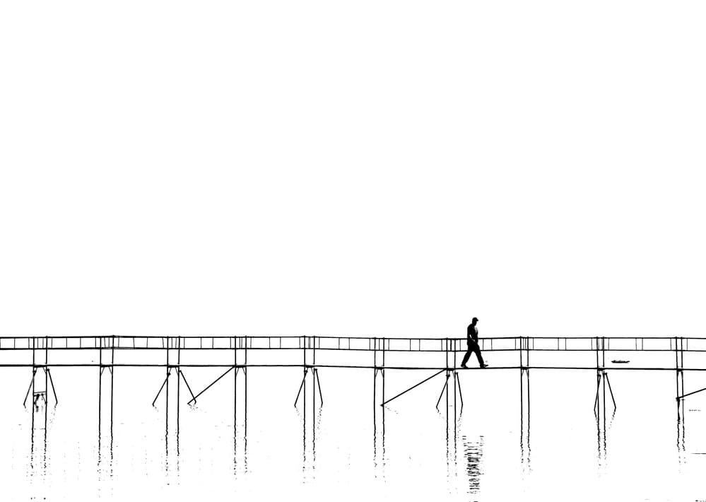 Lone Figure on Bridge by Hans Peter Rank — canvas wall art