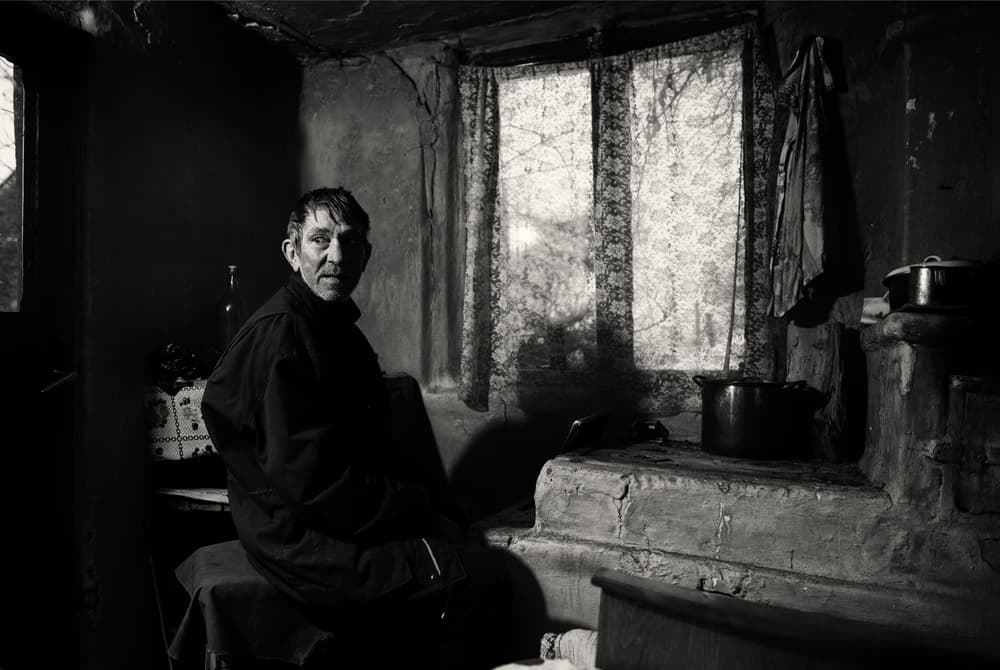 Elderly Man Rustic Home by Julien Oncete — canvas wall art
