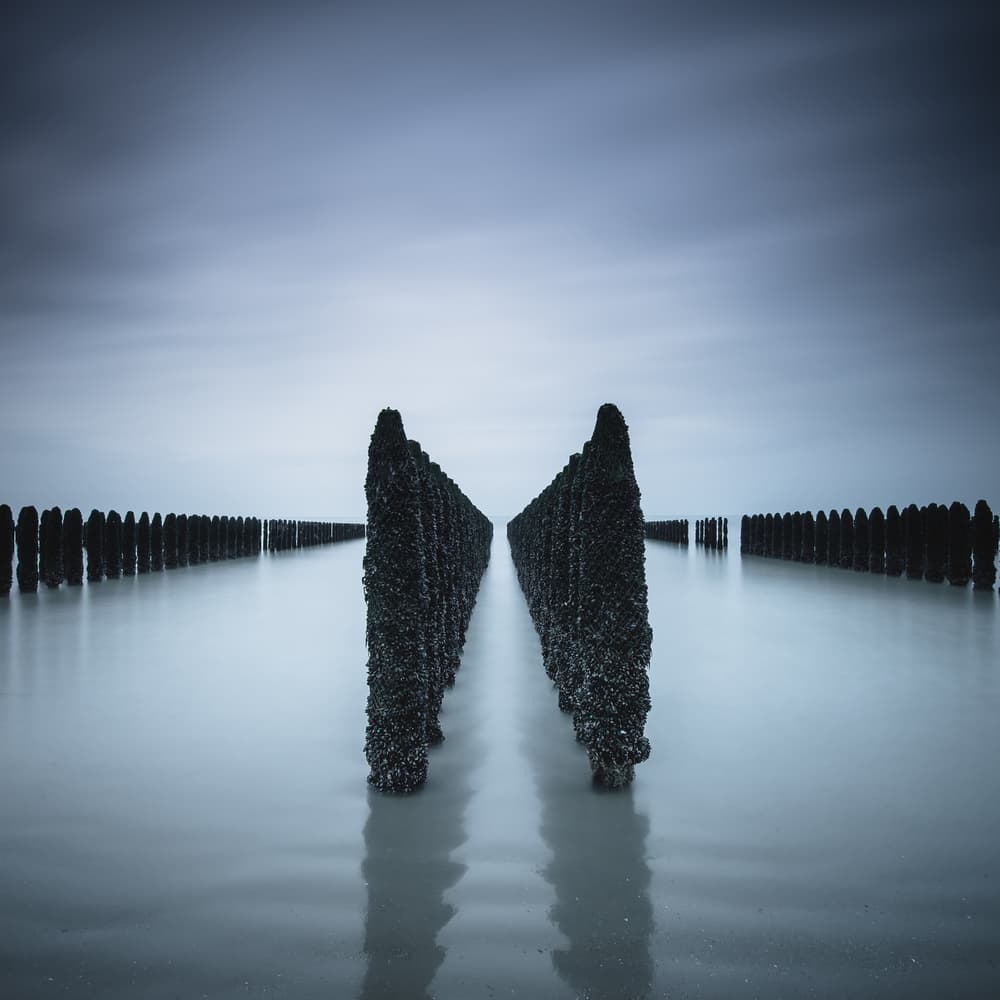 Serene Coastal Pilings by Christophe Staelens — canvas wall art