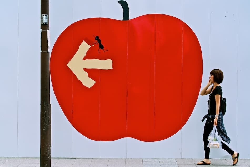 Walking Past Red Apple by Shinji Isobe — canvas wall art
