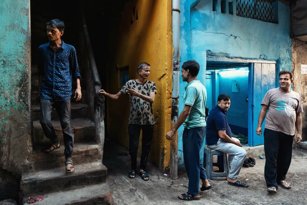 Alleyway Social Scene by Kuntal Biswas — canvas wall art