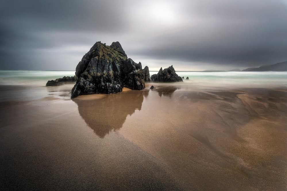 Moody Beach Rocks by Srecko Jubic — canvas wall art