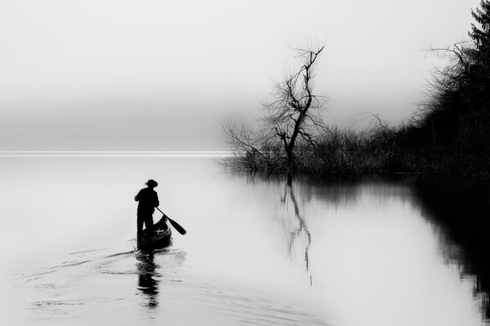 Man Paddling Misty Lake by Damijan Sedevcic — canvas wall art