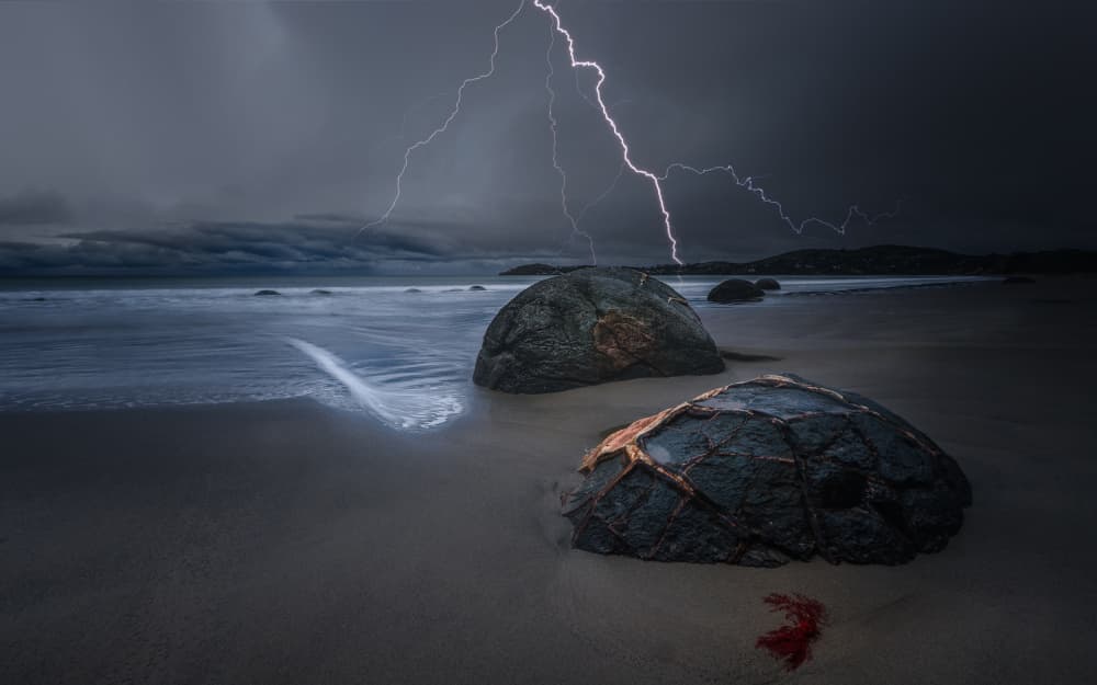 Lightning Over Coastal Boulders by YANGYING — canvas wall art