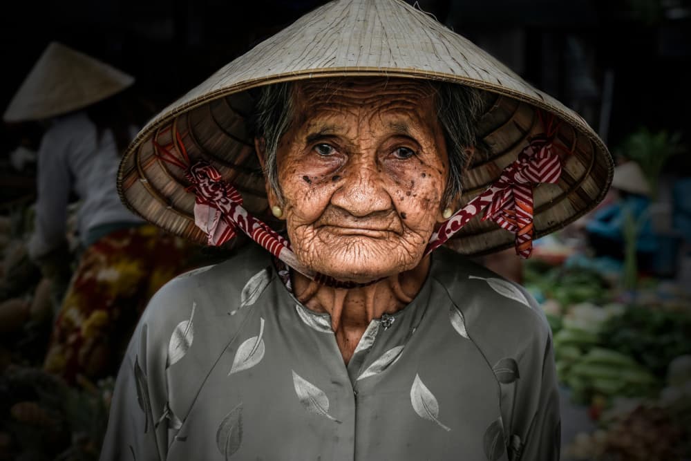 Vietnamese Market Woman by Irene Perovich — canvas wall art