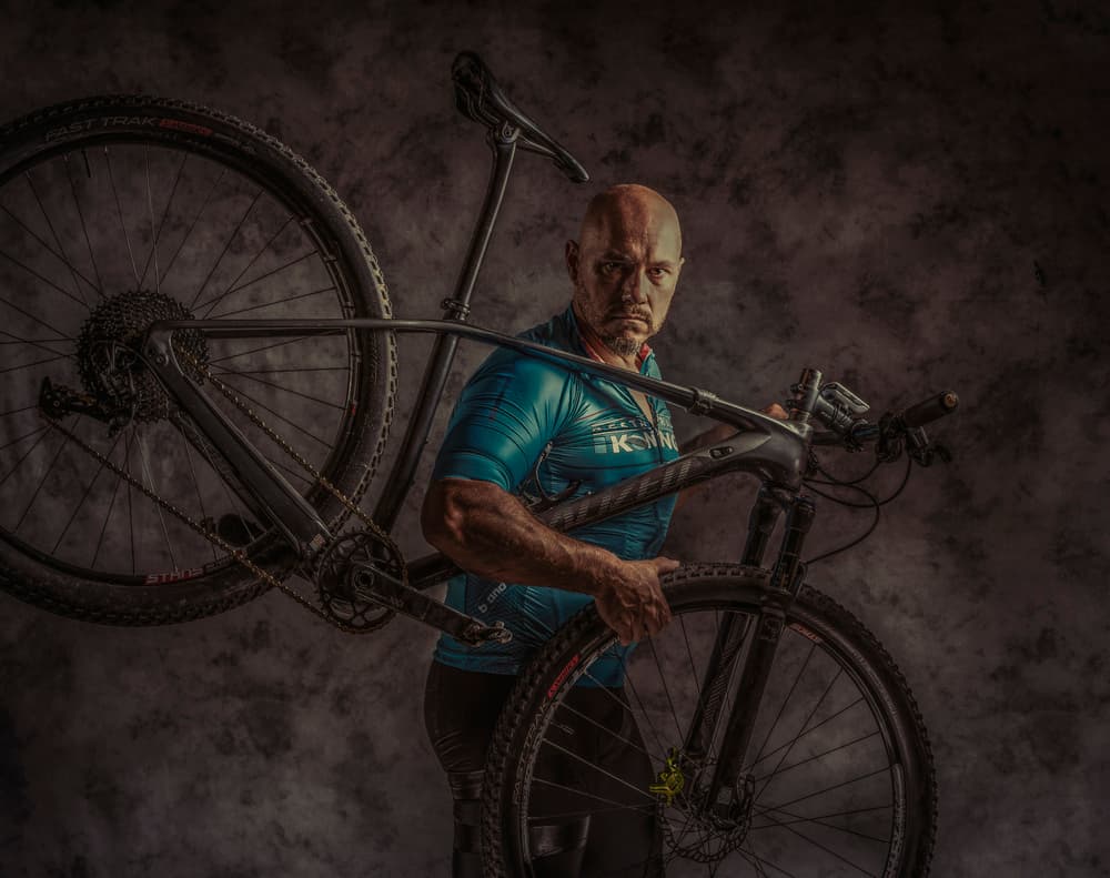 Intense Cyclist With Bike by gNo — canvas wall art