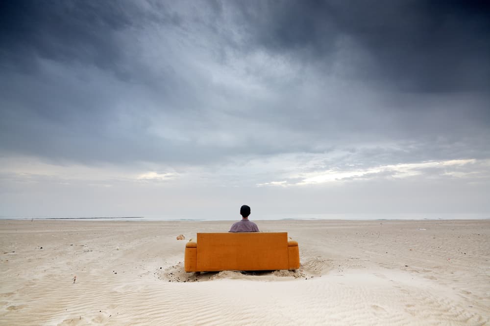 Man on Desert Sofa by Felix Tchvertkin — canvas wall art